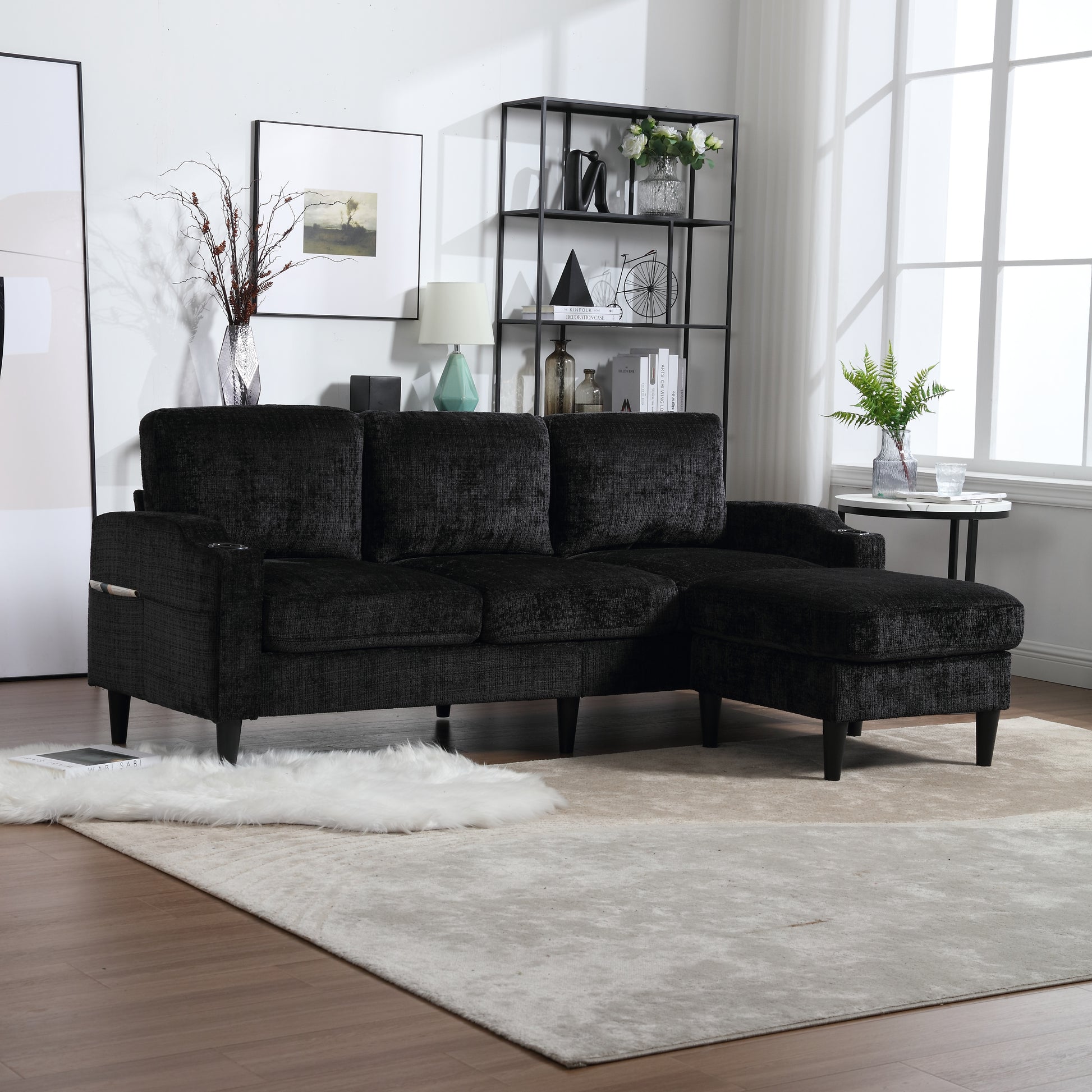 Black textured fabric sectional sofa with chaise lounge and plush cushions