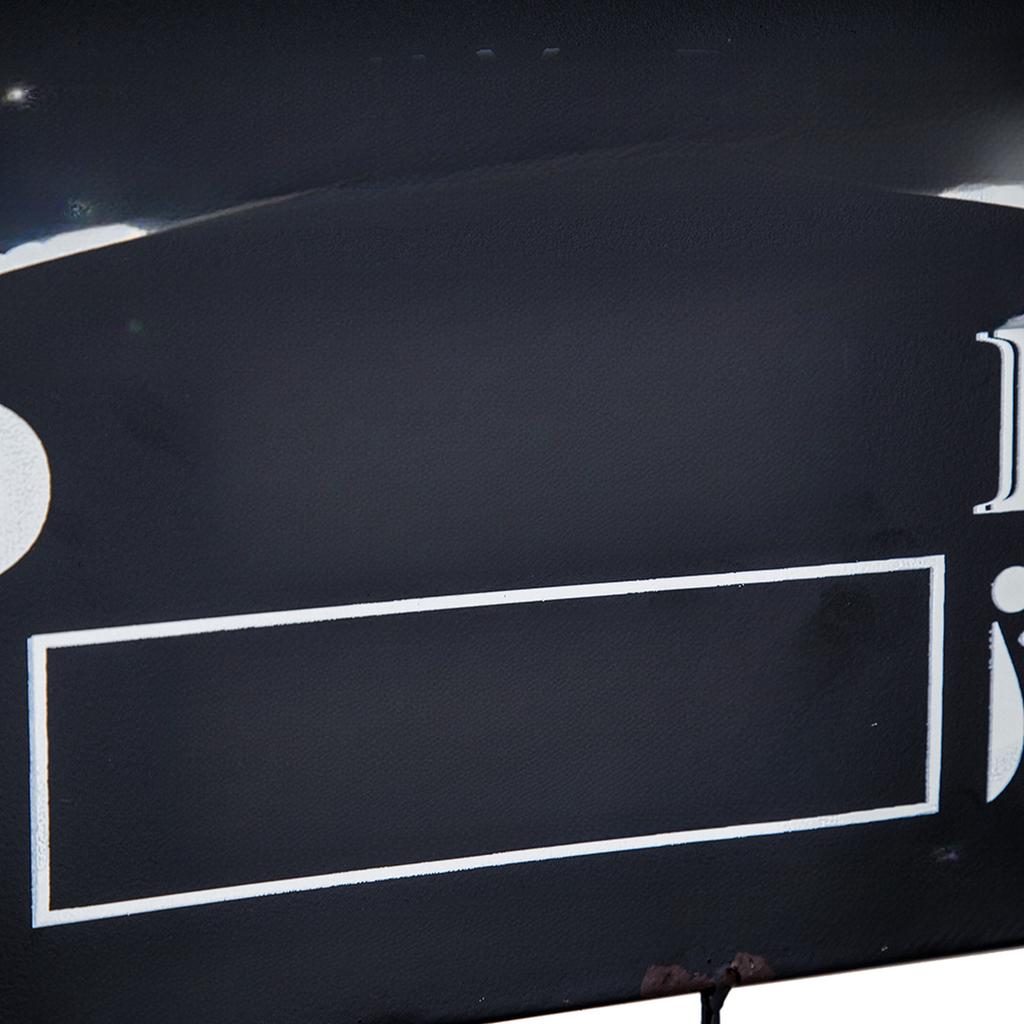 Vintage black metal sign with white border and text space