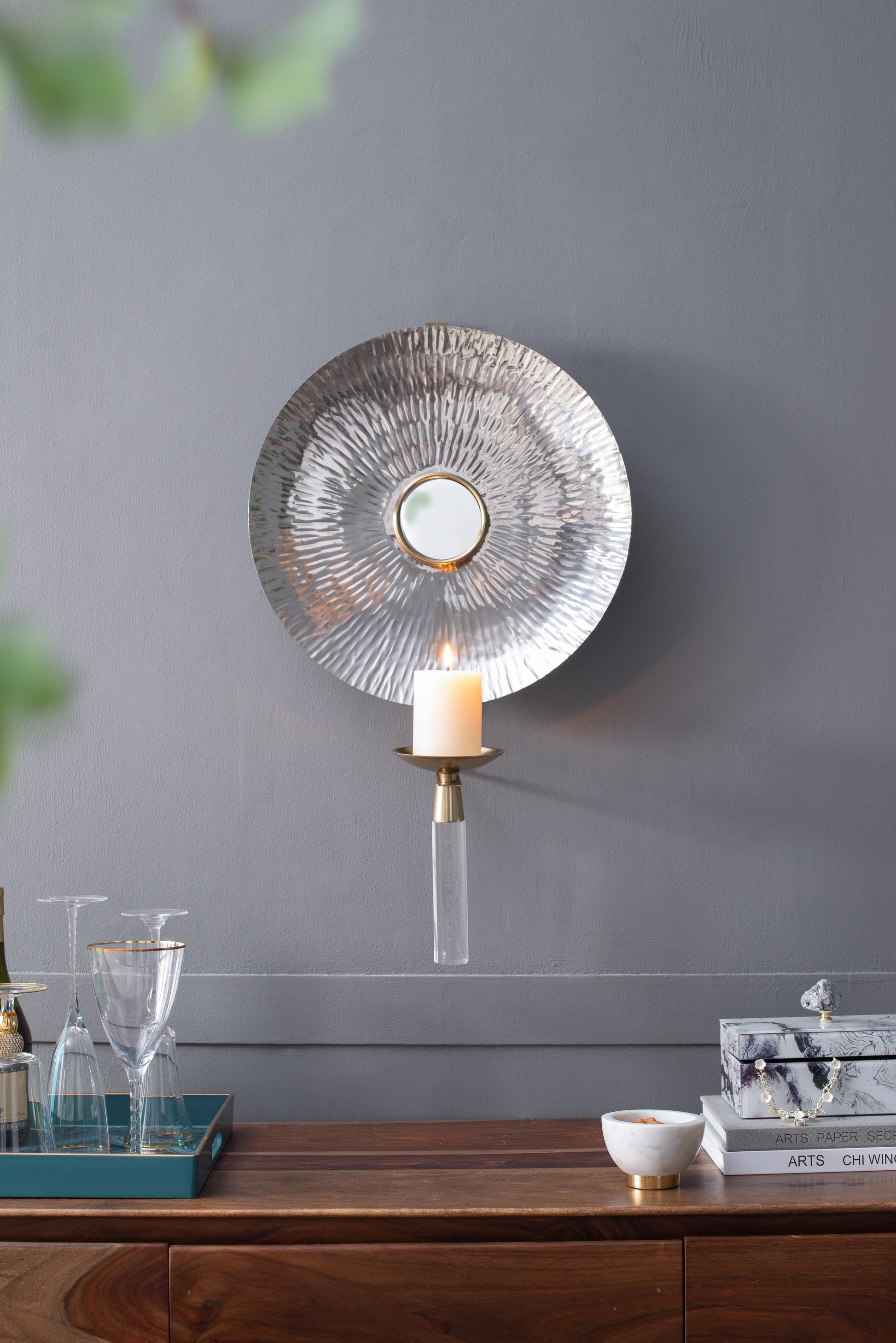 Textured silver wall sconce with hammered metal design gold accents and clear acrylic arm