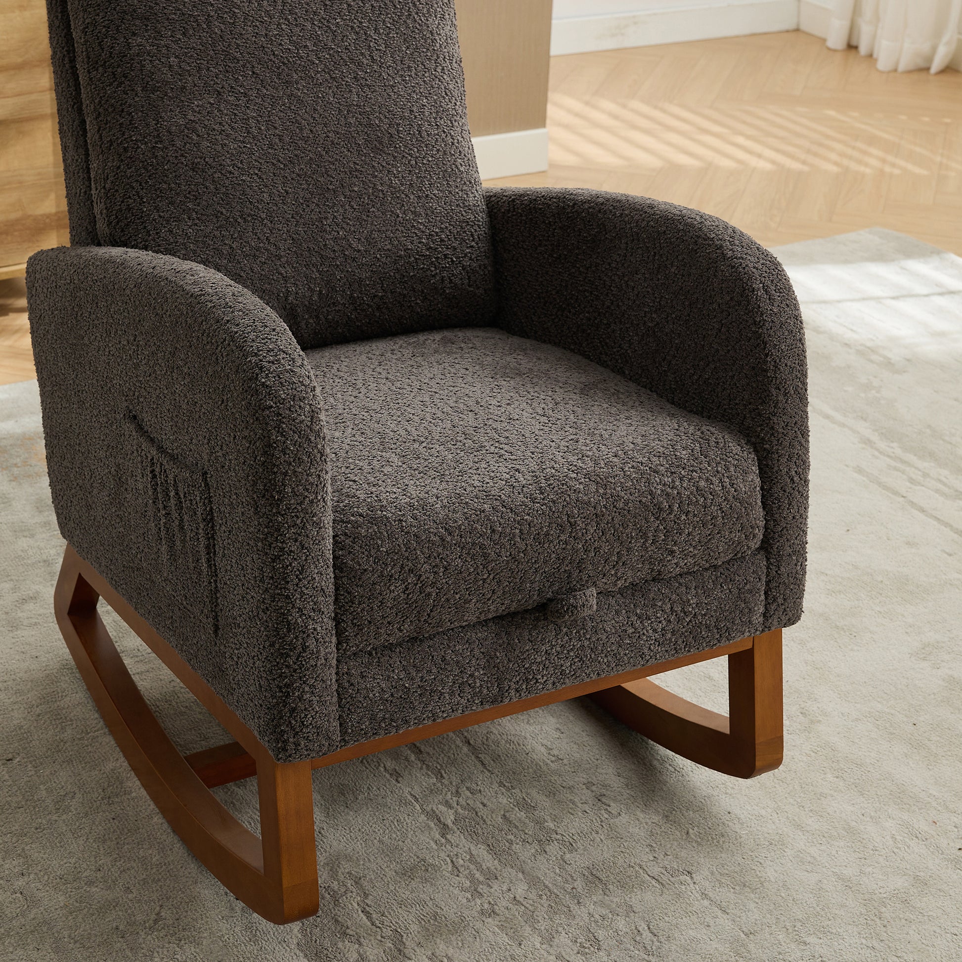 Dark gray textured fabric rocking chair with wooden base and side pocket