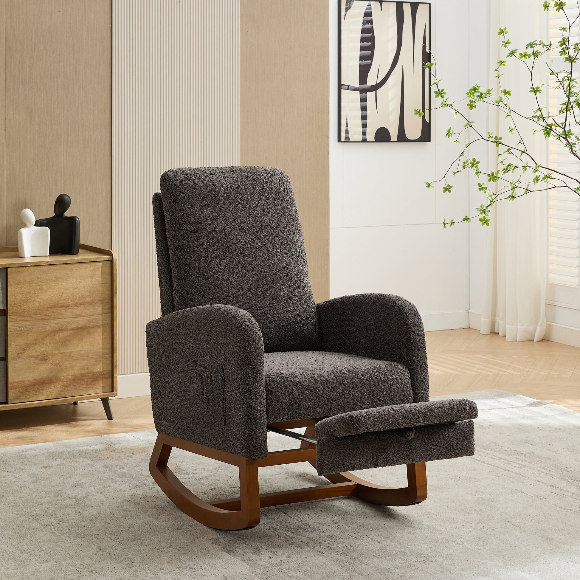 Dark gray boucle fabric rocking chair with wooden base and extended footrest for ultimate comfort