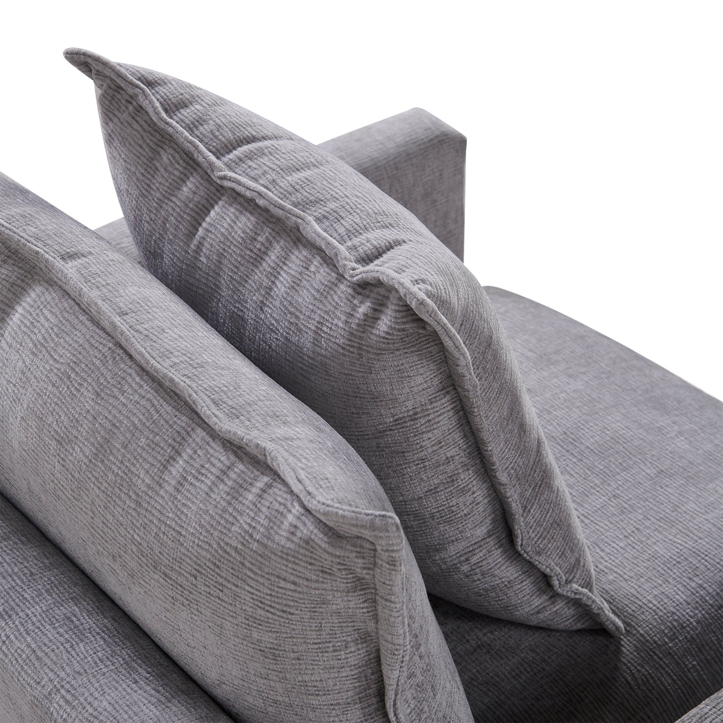 Textured grey fabric couch cushions with tailored piping and stitching detail