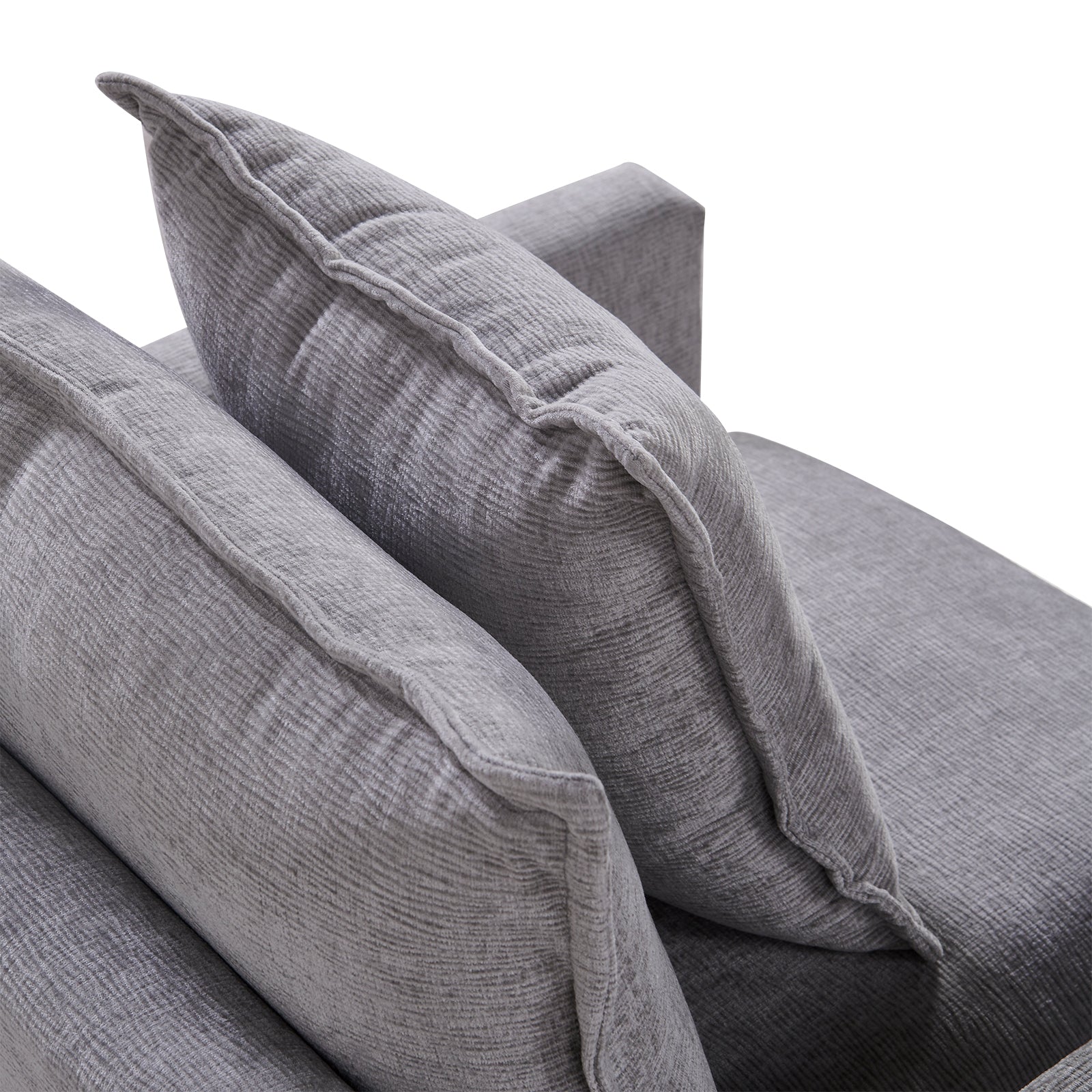 Textured grey fabric couch cushions with tailored piping and stitching detail