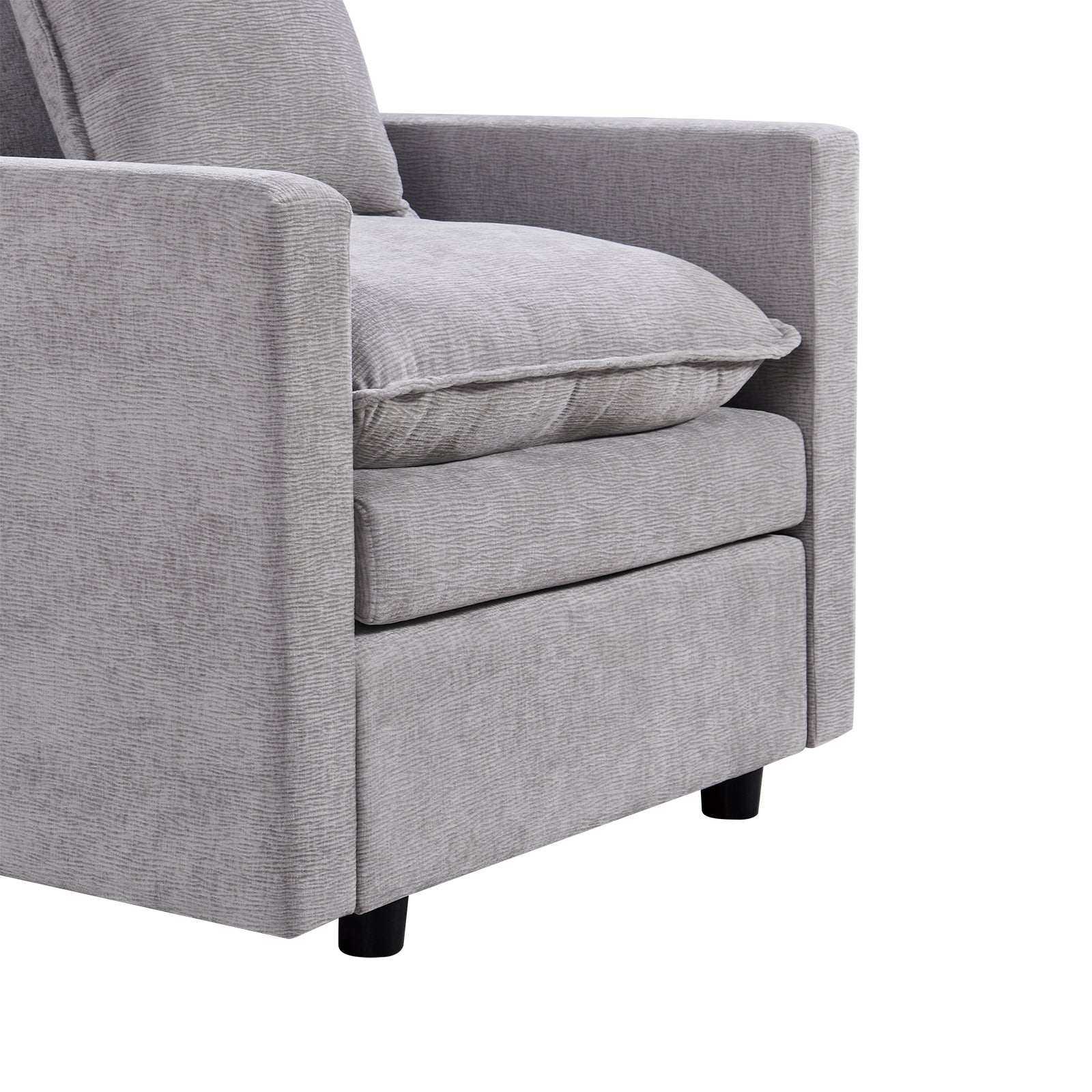 Closeup of a modern grey fabric armchair with textured upholstery and black legs perfect for living rooms