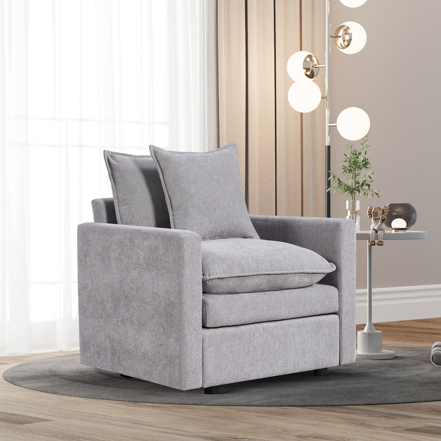 Plush grey fabric armchair with deep seat cushions and back pillows