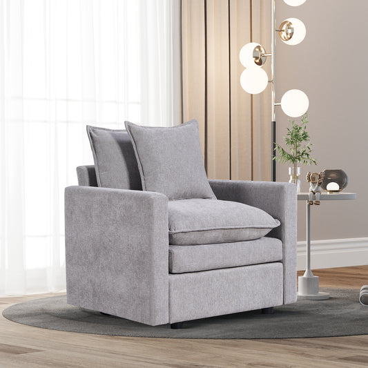 Plush grey fabric armchair with deep seat cushions and back pillows