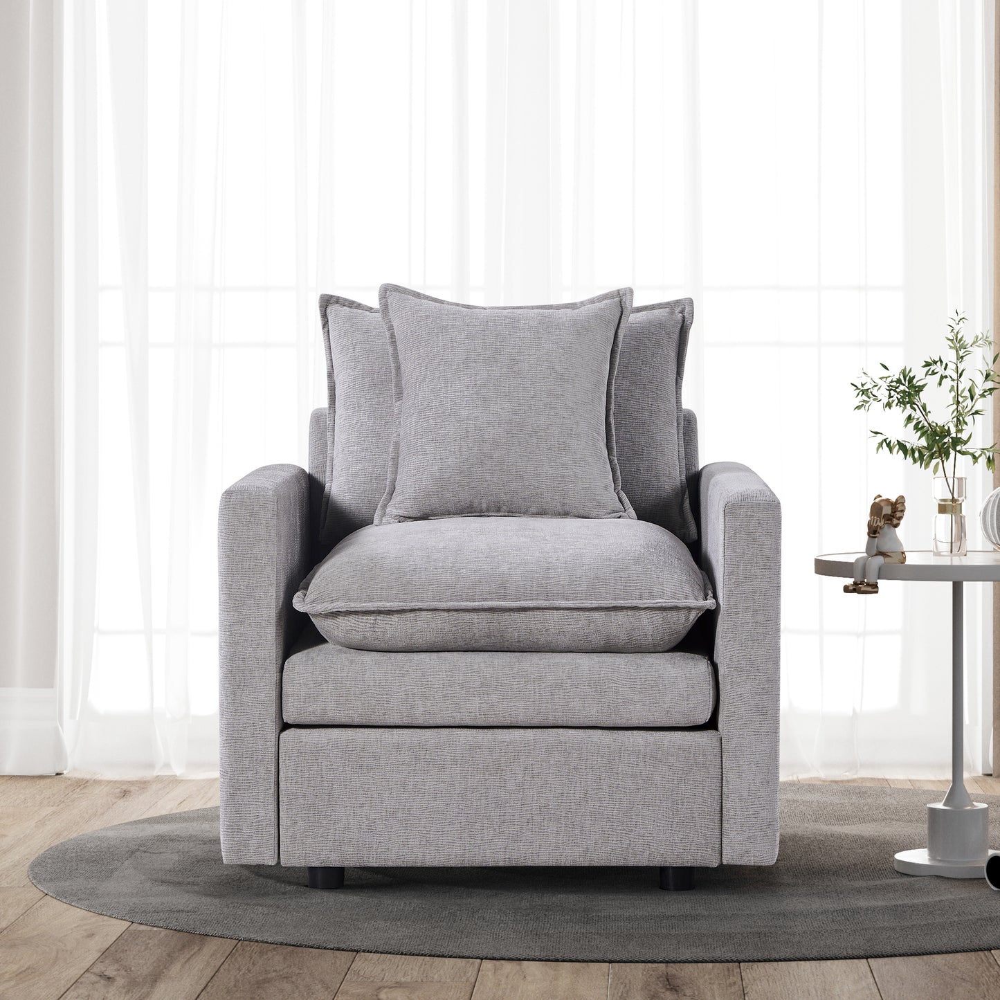 Plush gray fabric armchair with textured cushions and modern design