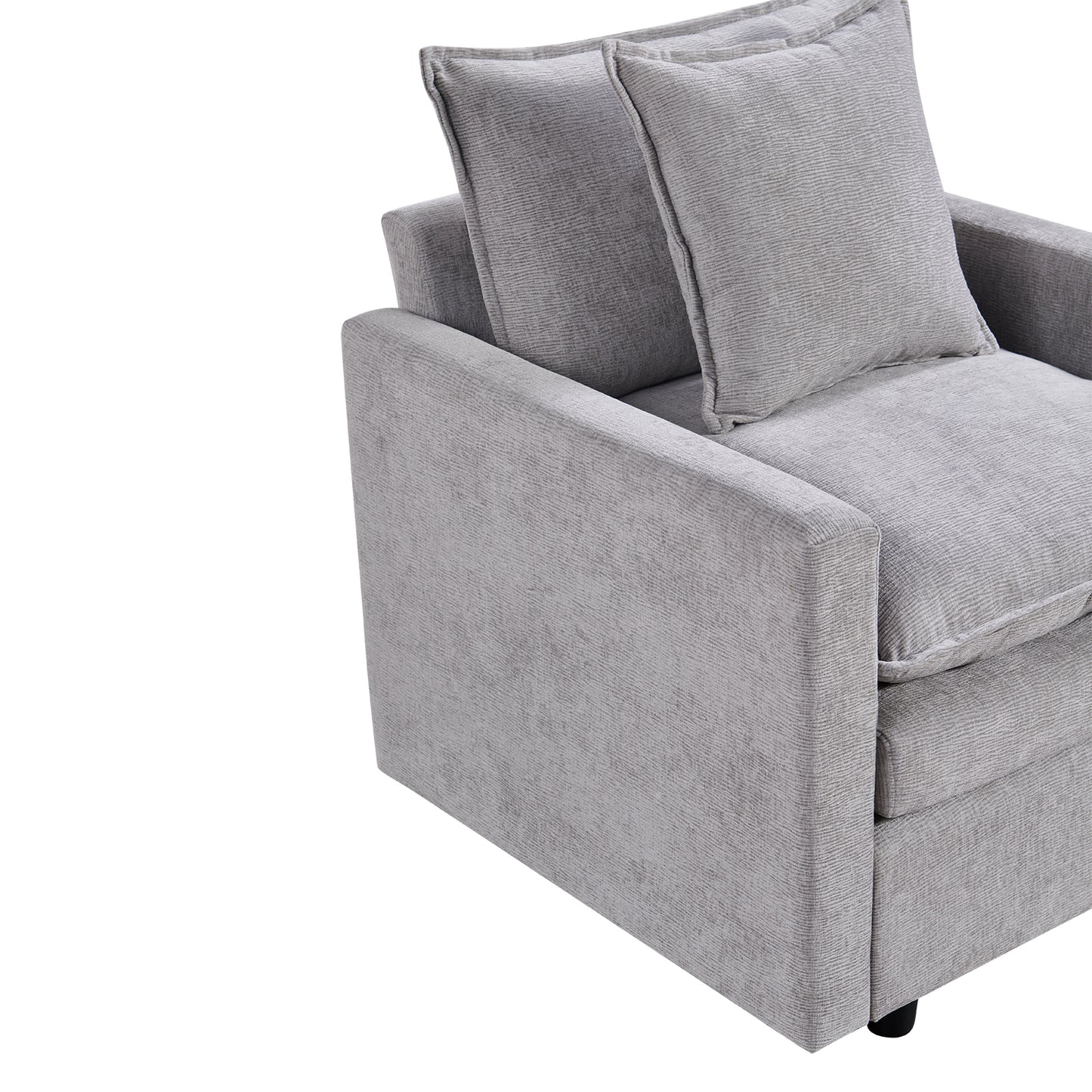 Modern grey upholstered armchair with textured fabric and plush throw pillows