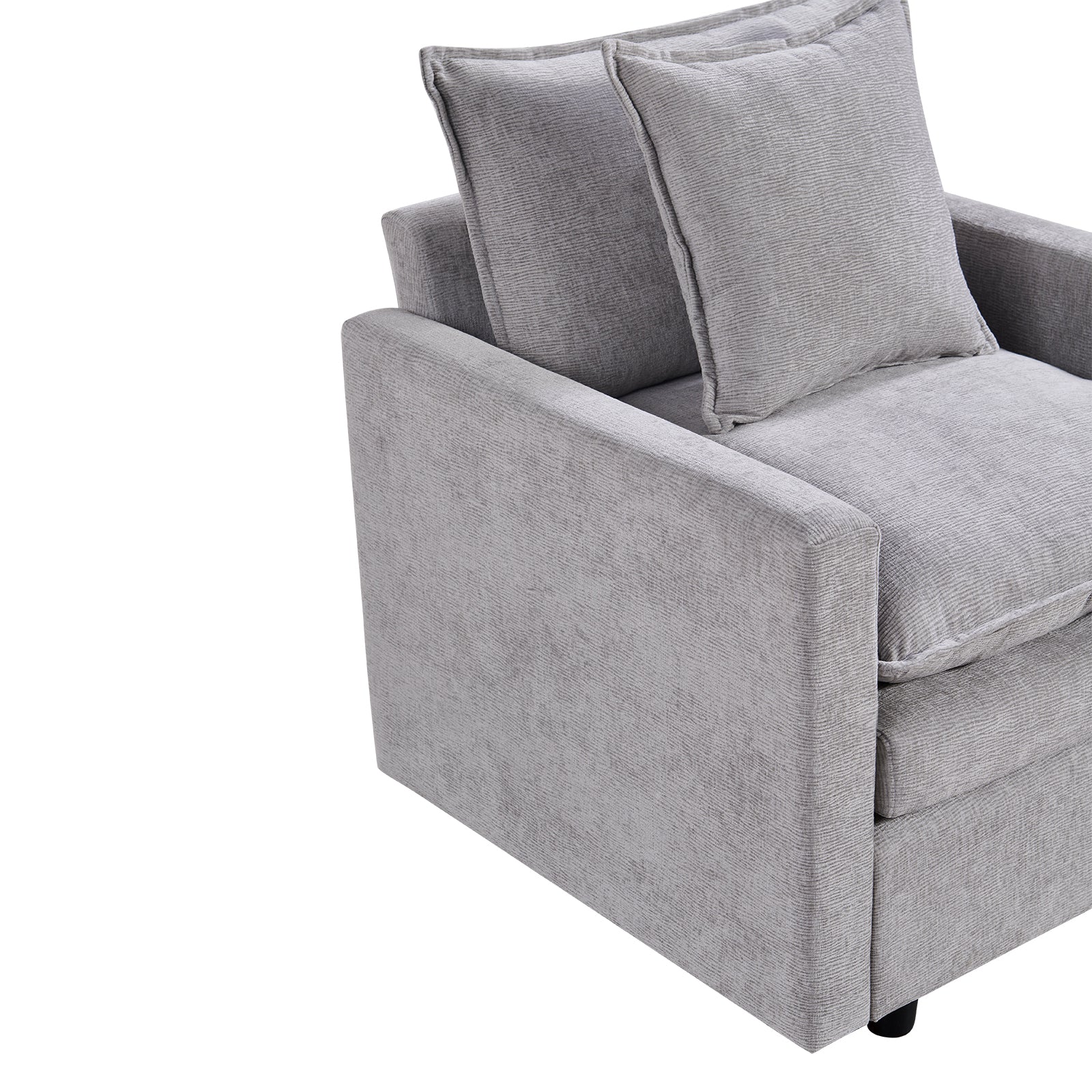 Modern grey upholstered armchair with textured fabric and plush throw pillows