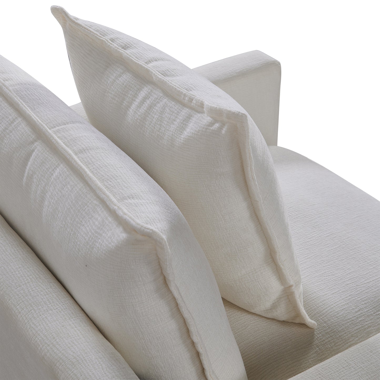 Closeup of plush white linen sofa cushions offering comfort and modern style