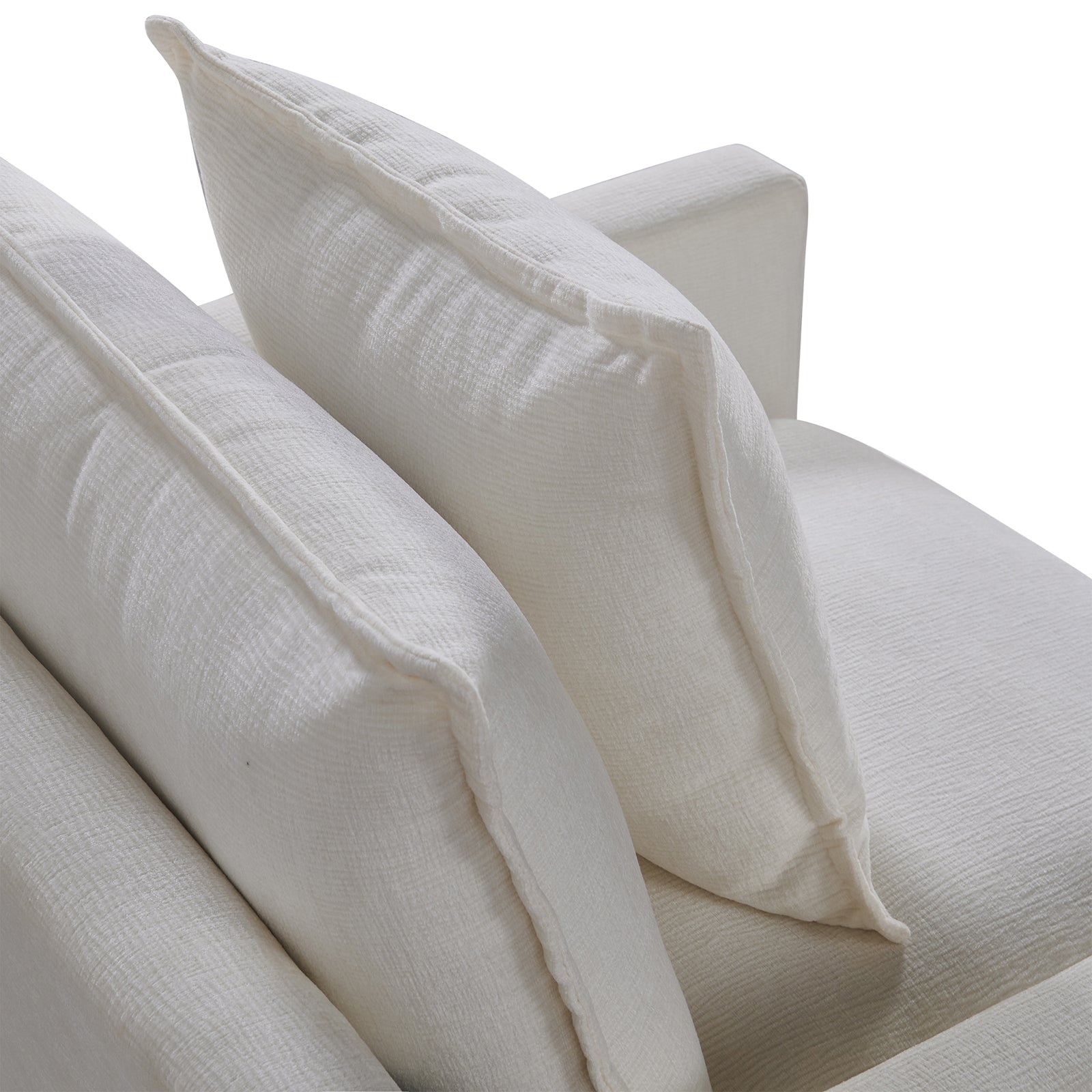 Closeup of plush white linen sofa cushions offering comfort and modern style