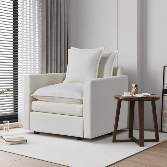 Plush cream upholstered armchair with textured fabric and comfortable throw pillows