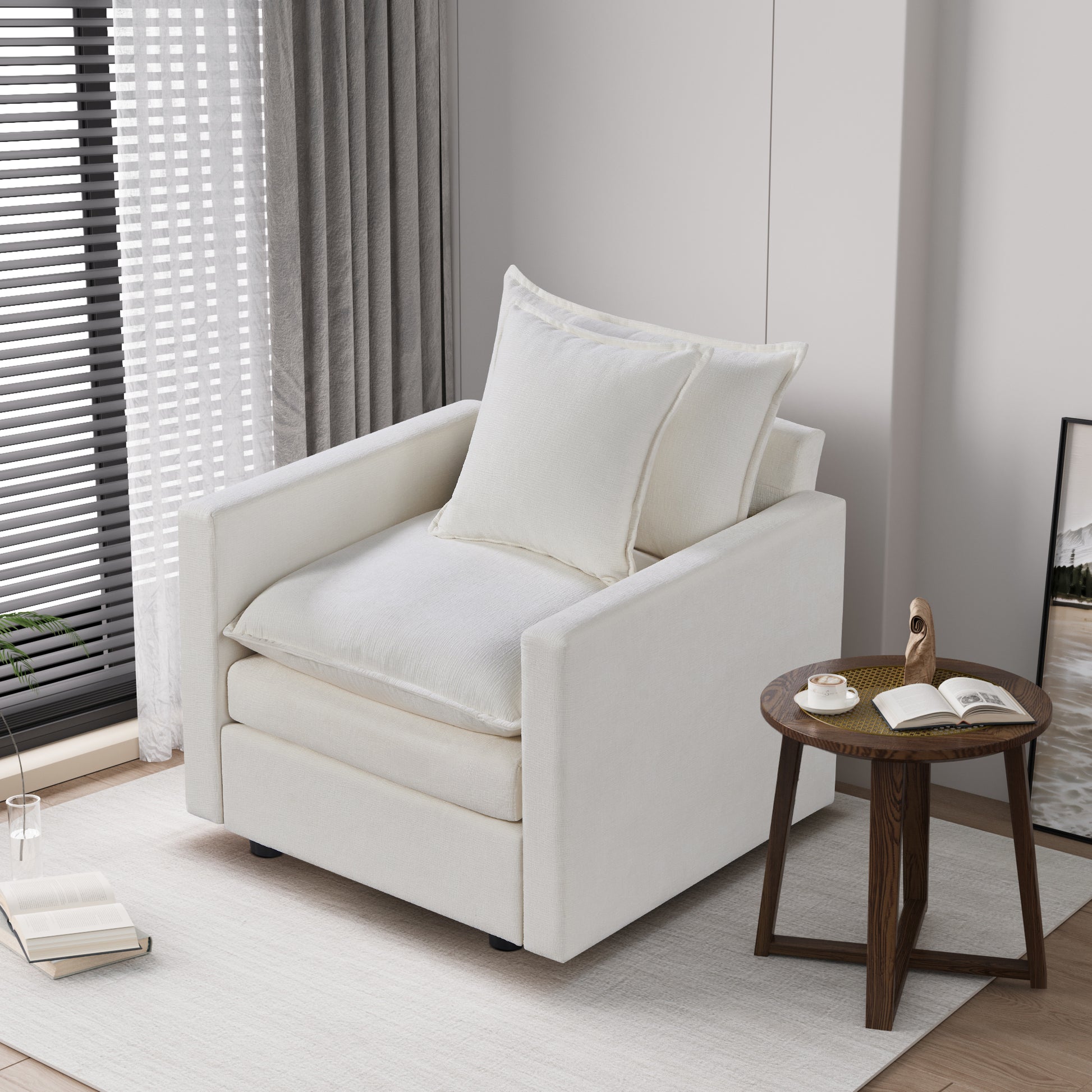 Plush white linen armchair with two matching throw pillows perfect for a cozy reading nook