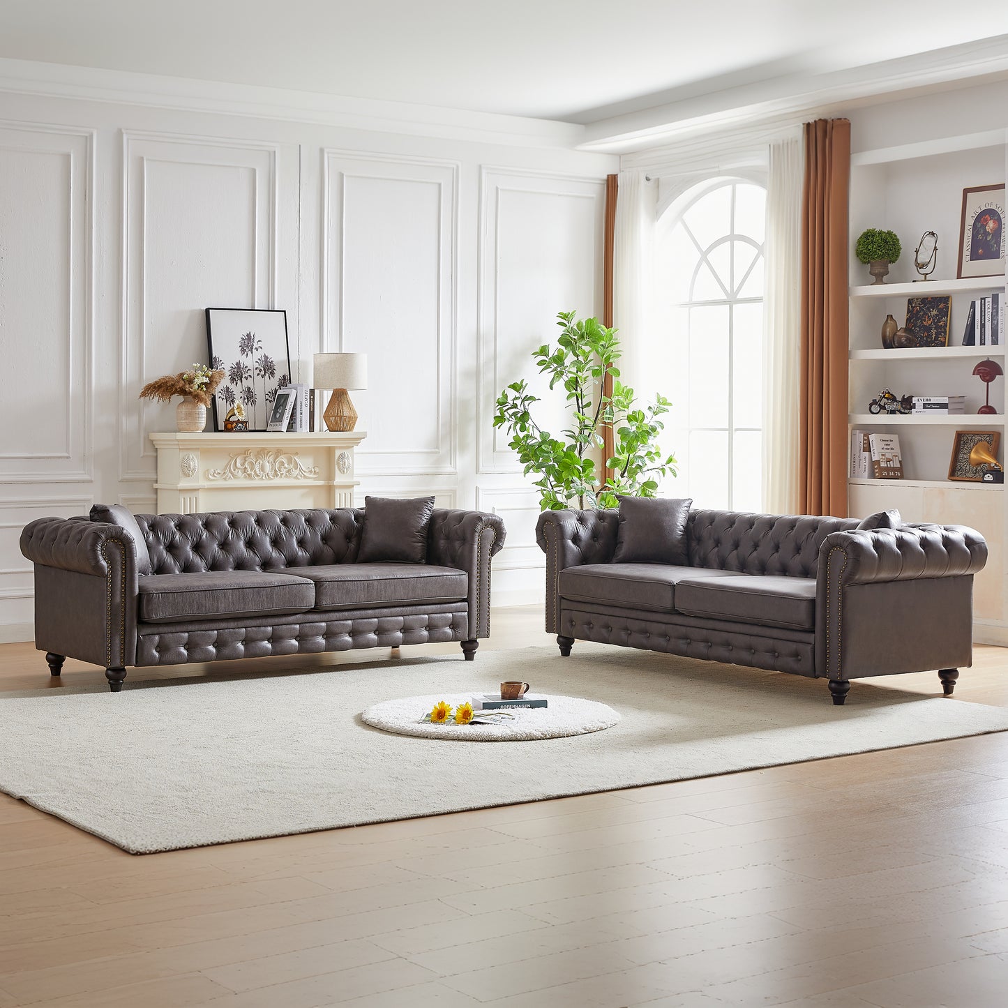 Gray tufted leather chesterfield sofa set with studded accents and plush cushions