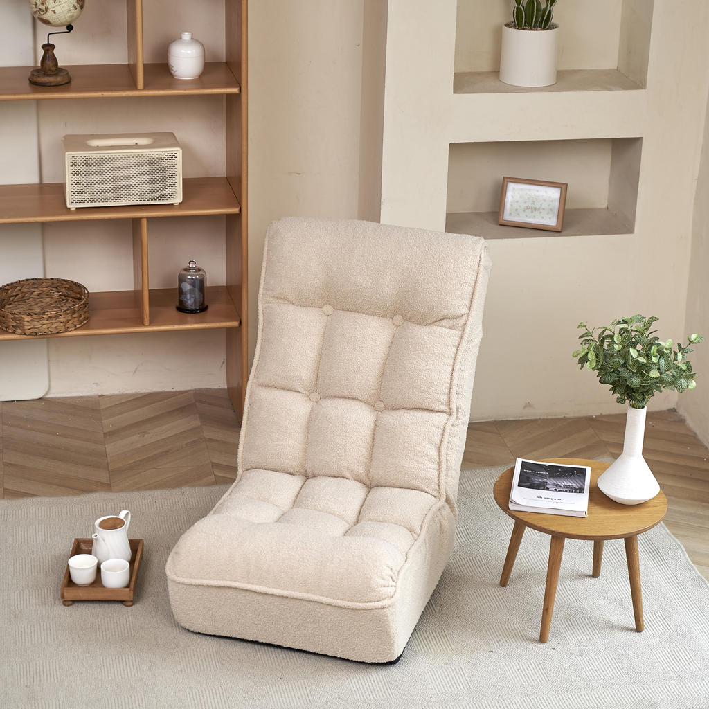 Creamcolored floor chair with tufted cushions for cozy relaxation