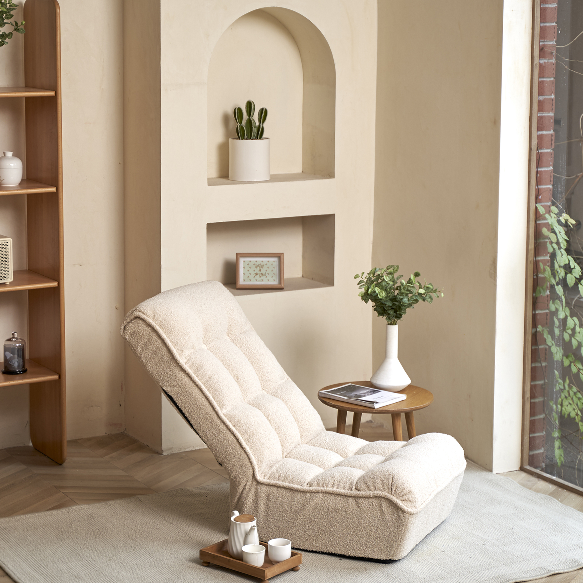 Cream boucle fabric floor chair with adjustable back for comfortable lounging