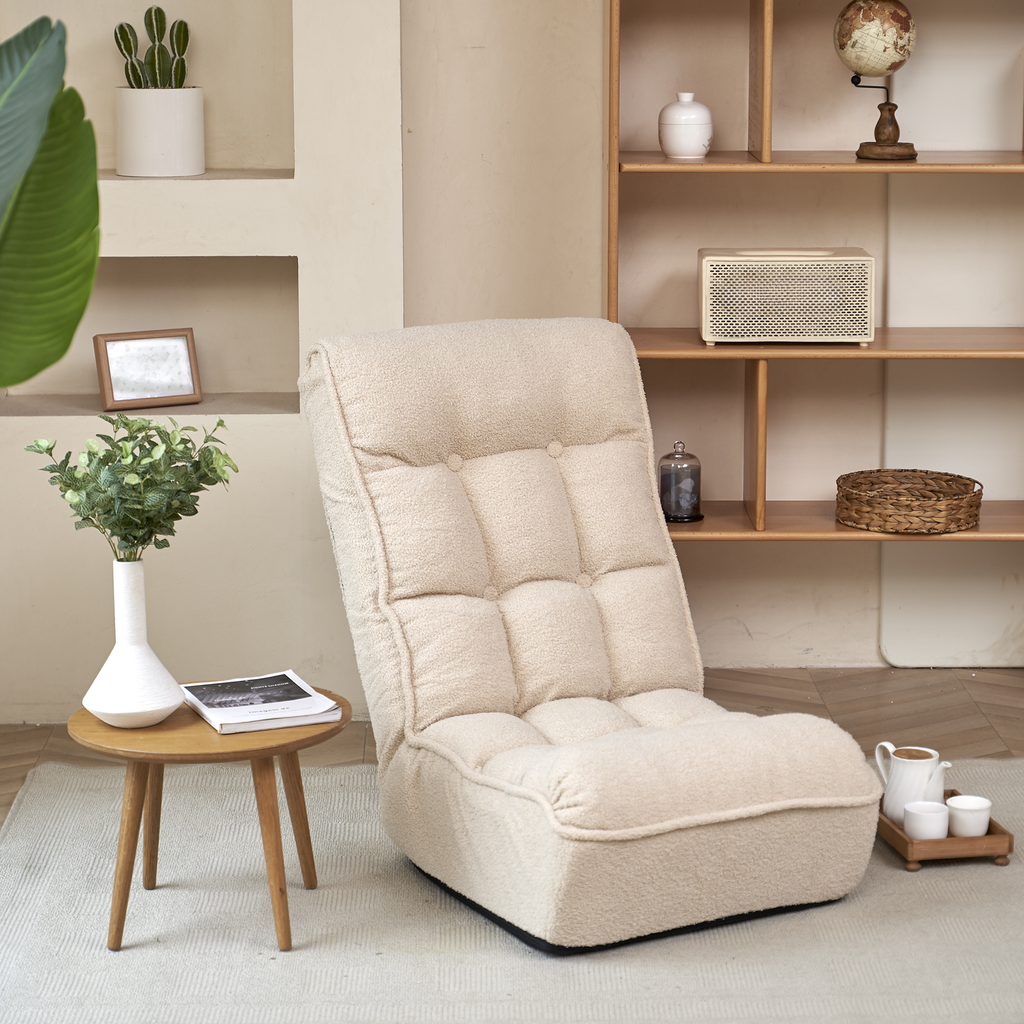 Cream boucle floor chair with tufted backrest and comfortable seat