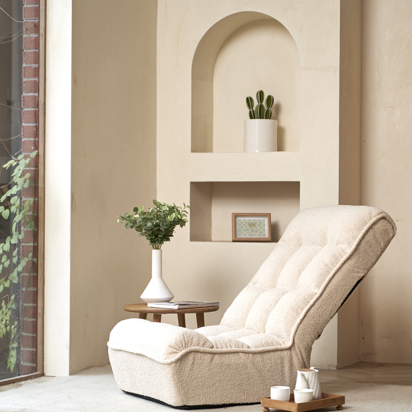 Cream boucle floor chair with plush quilting for ultimate comfort