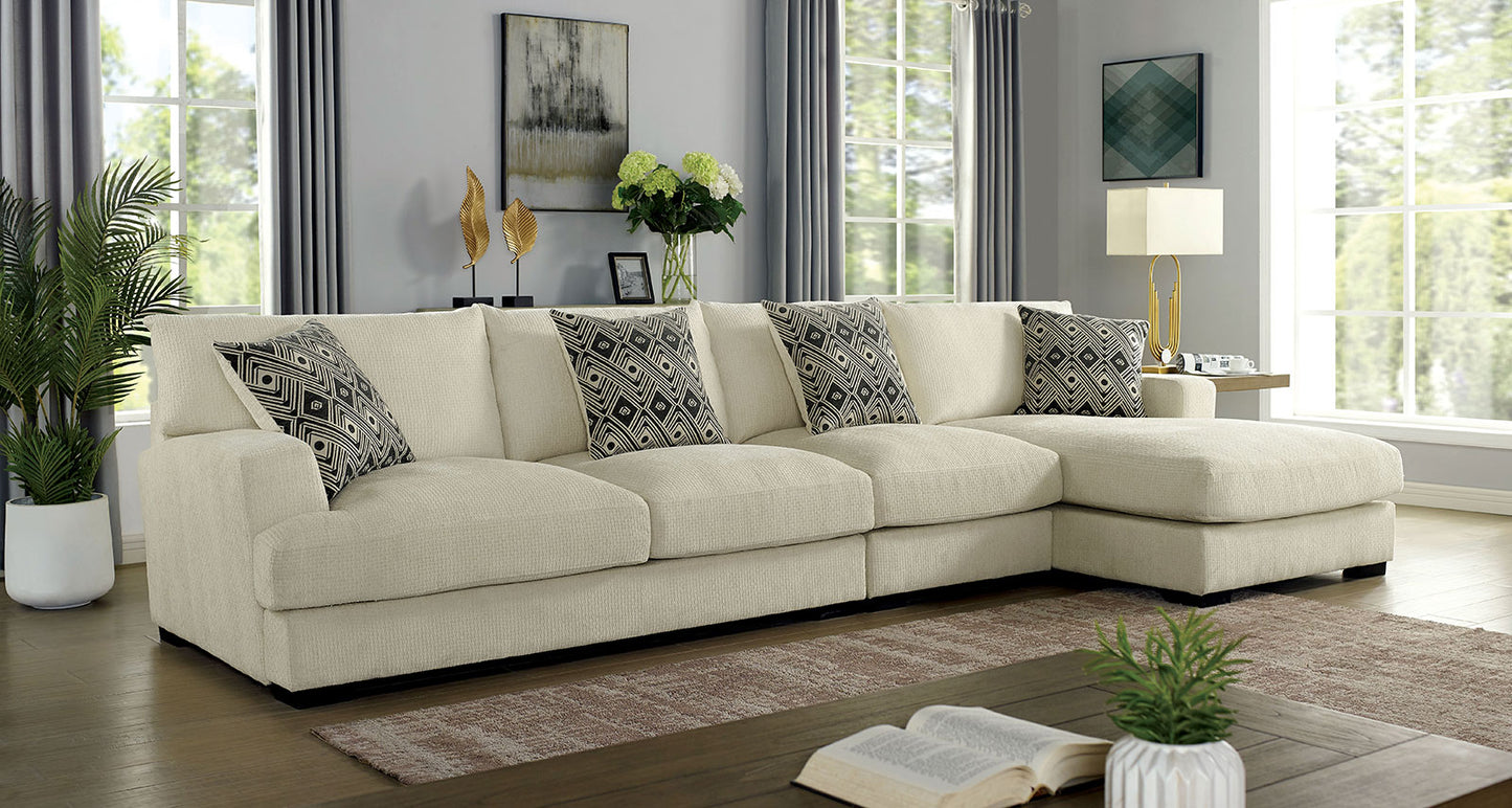 Cream textured fabric sectional sofa with geometric print throw pillows