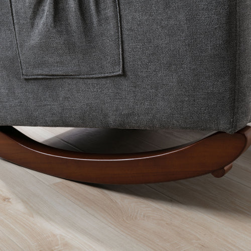 Close up of a dark gray fabric rocking chair base with wooden runners