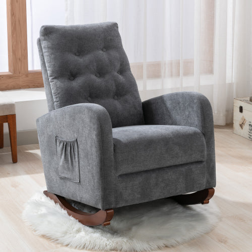 Dark grey upholstered rocking chair with button tufting and side pocket