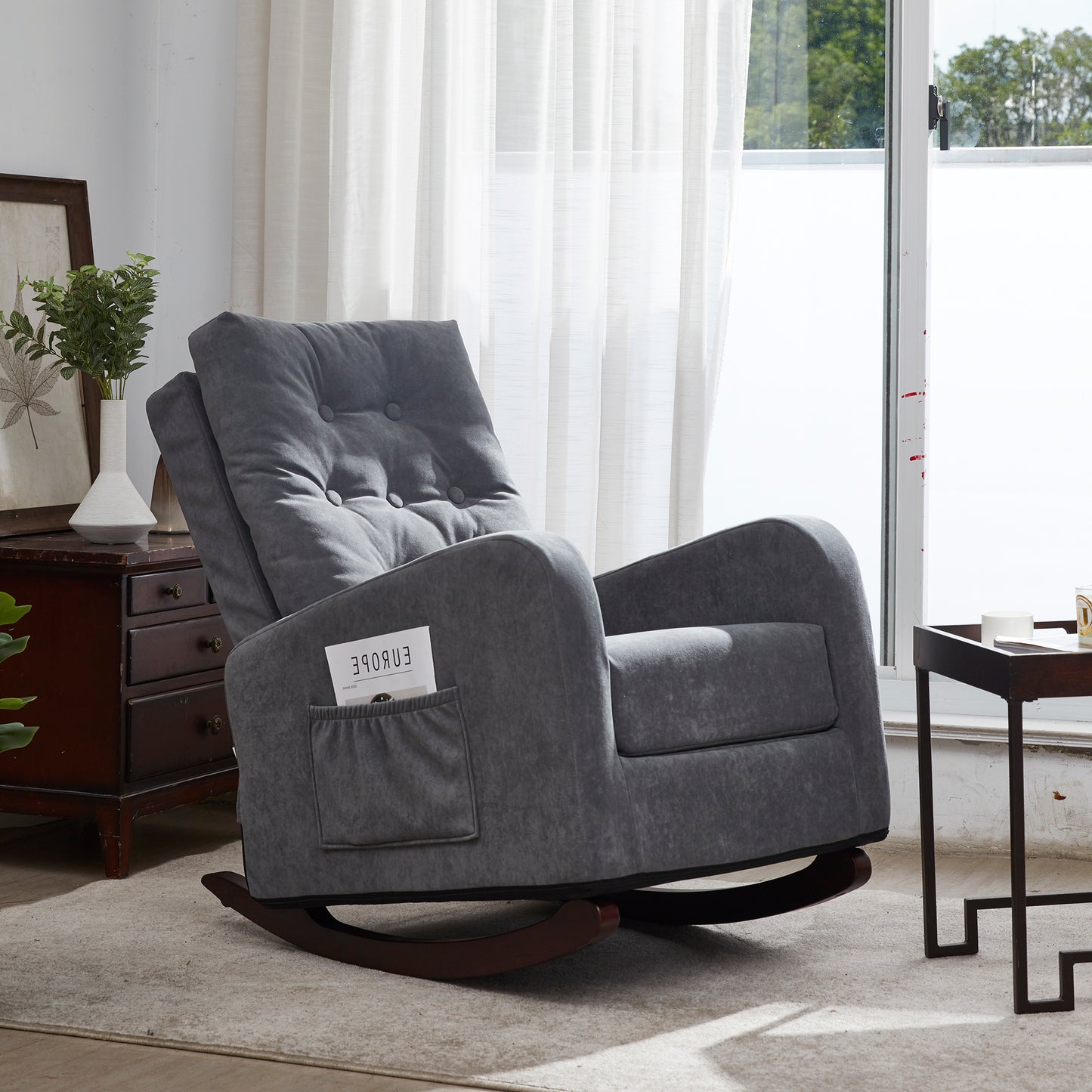 Plush grey fabric upholstered rocking chair with tufted back and side pocket