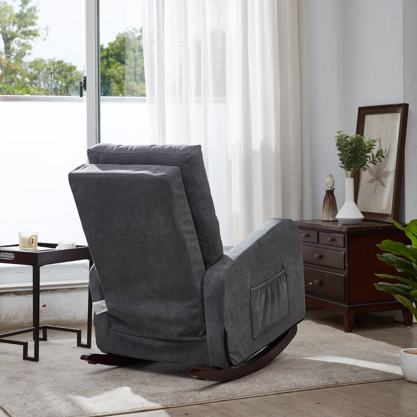 Dark gray upholstered rocking recliner with wooden base and side pocket
