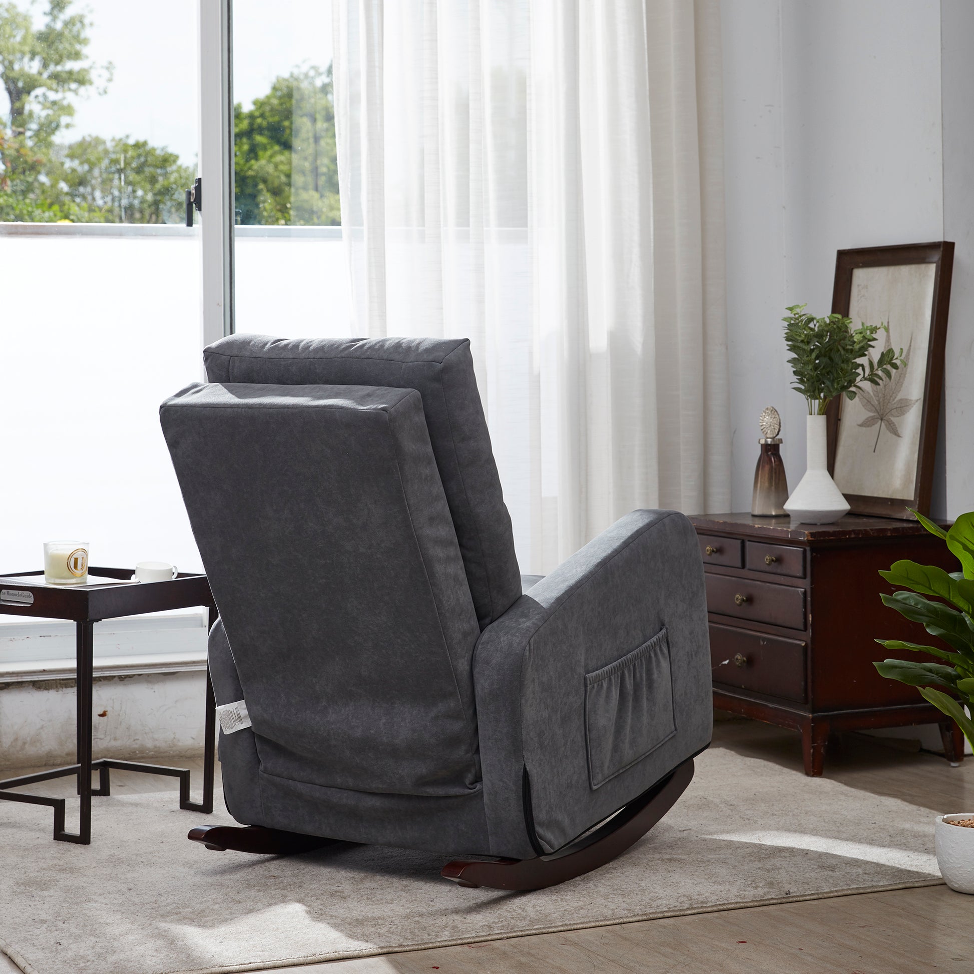 Dark gray upholstered rocking recliner with wooden base and side pocket