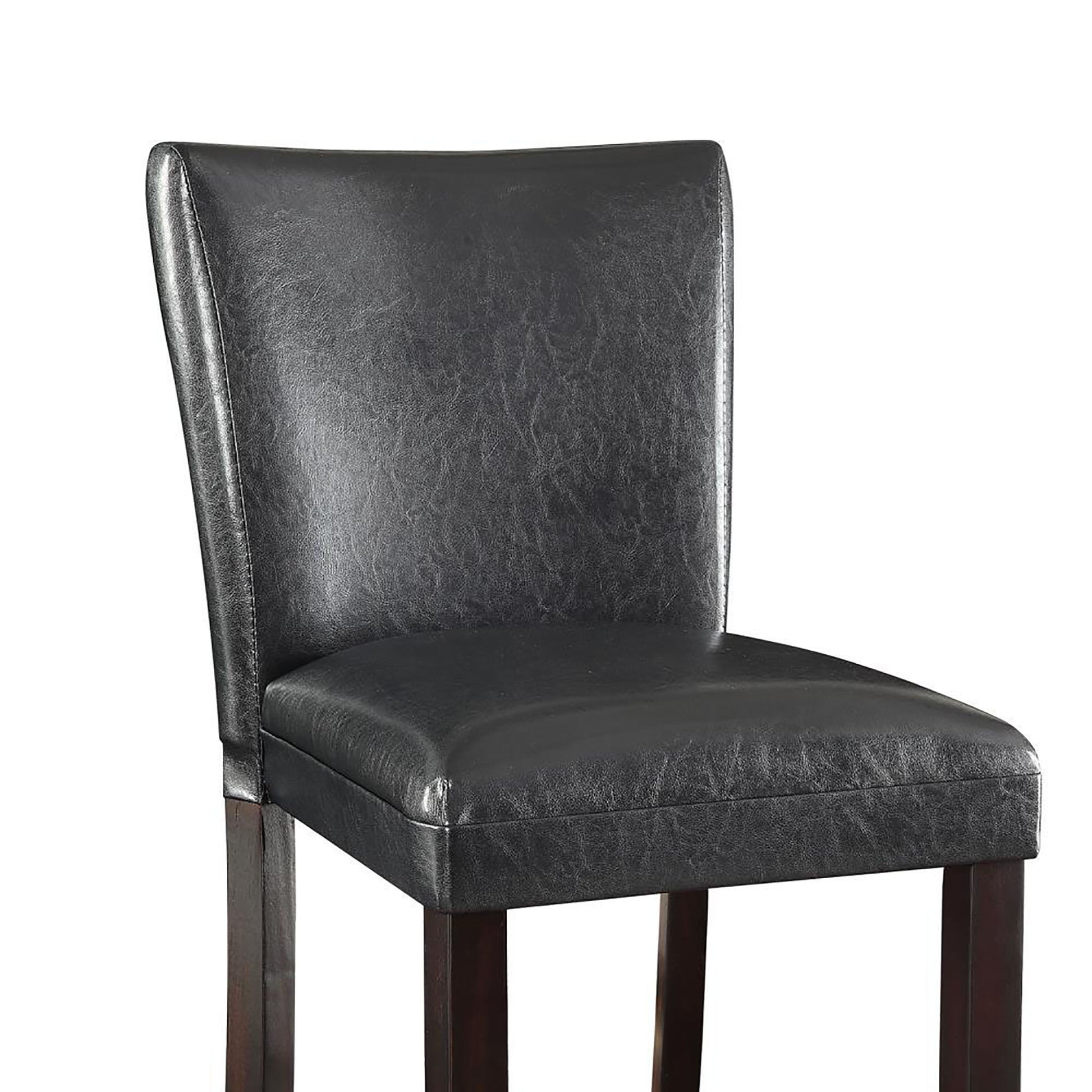 Closeup of black faux leather bar stool with dark wood legs and stitched detailing