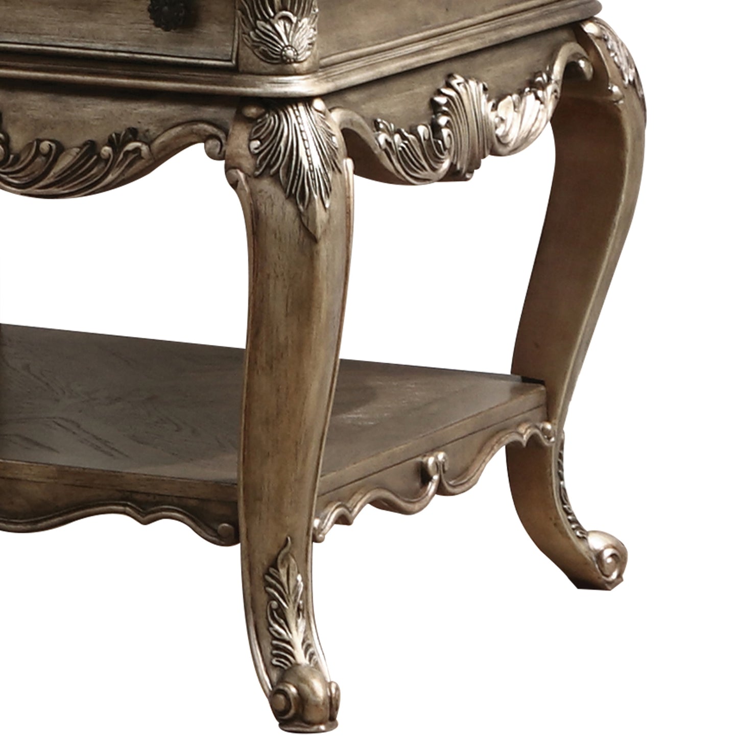 Antique gold accent table with carved legs and ornate scrollwork details