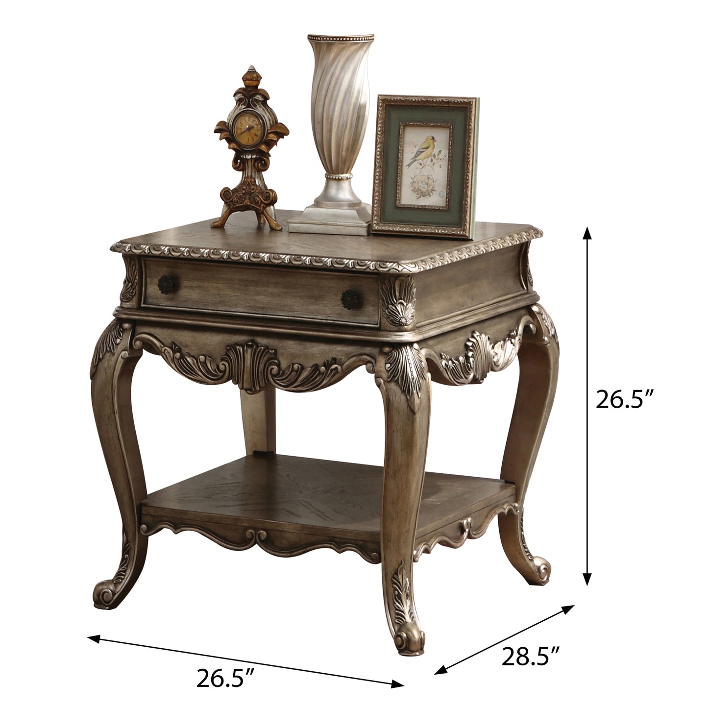 Ornate antique silver end table with carved details and decorative drawer pull