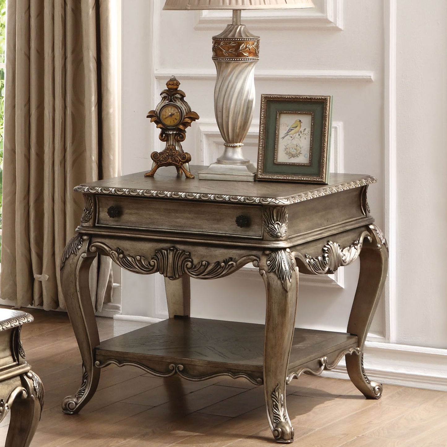 Antique carved wood end table with drawer and bottom shelf in bronze finish
