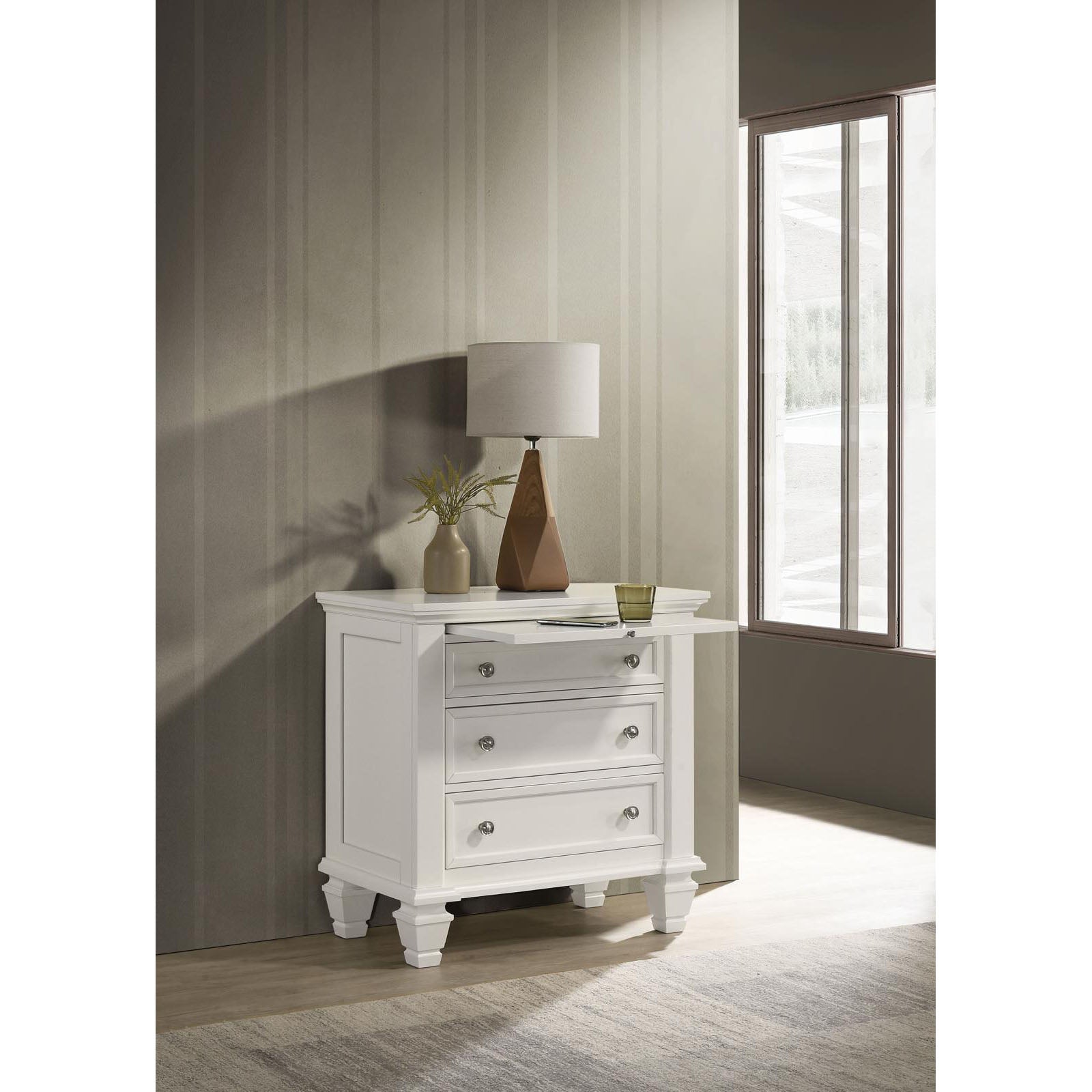 Classic white wooden nightstand with three drawers and pullout shelf perfect for bedroom storage