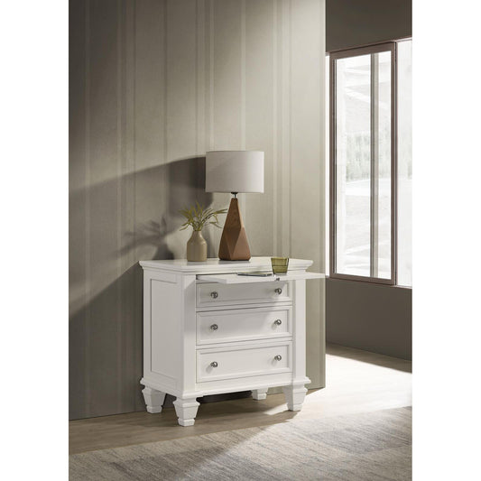 Classic white wooden nightstand with three drawers and pullout shelf perfect for bedroom storage