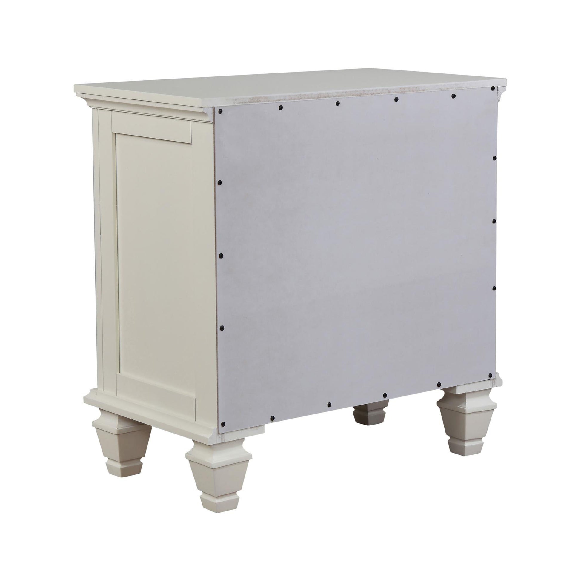 Cream bedside table with decorative turned legs and a paneled front detail