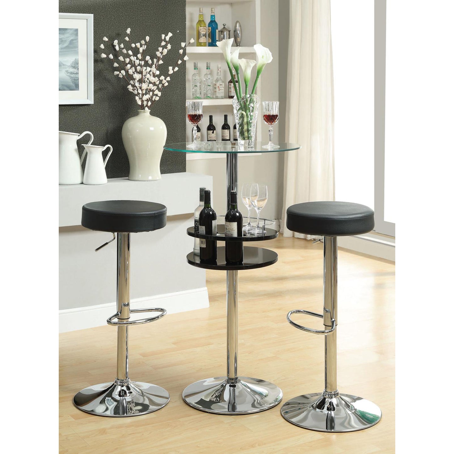 Adjustable height black leather bar stool with chrome base and footrest