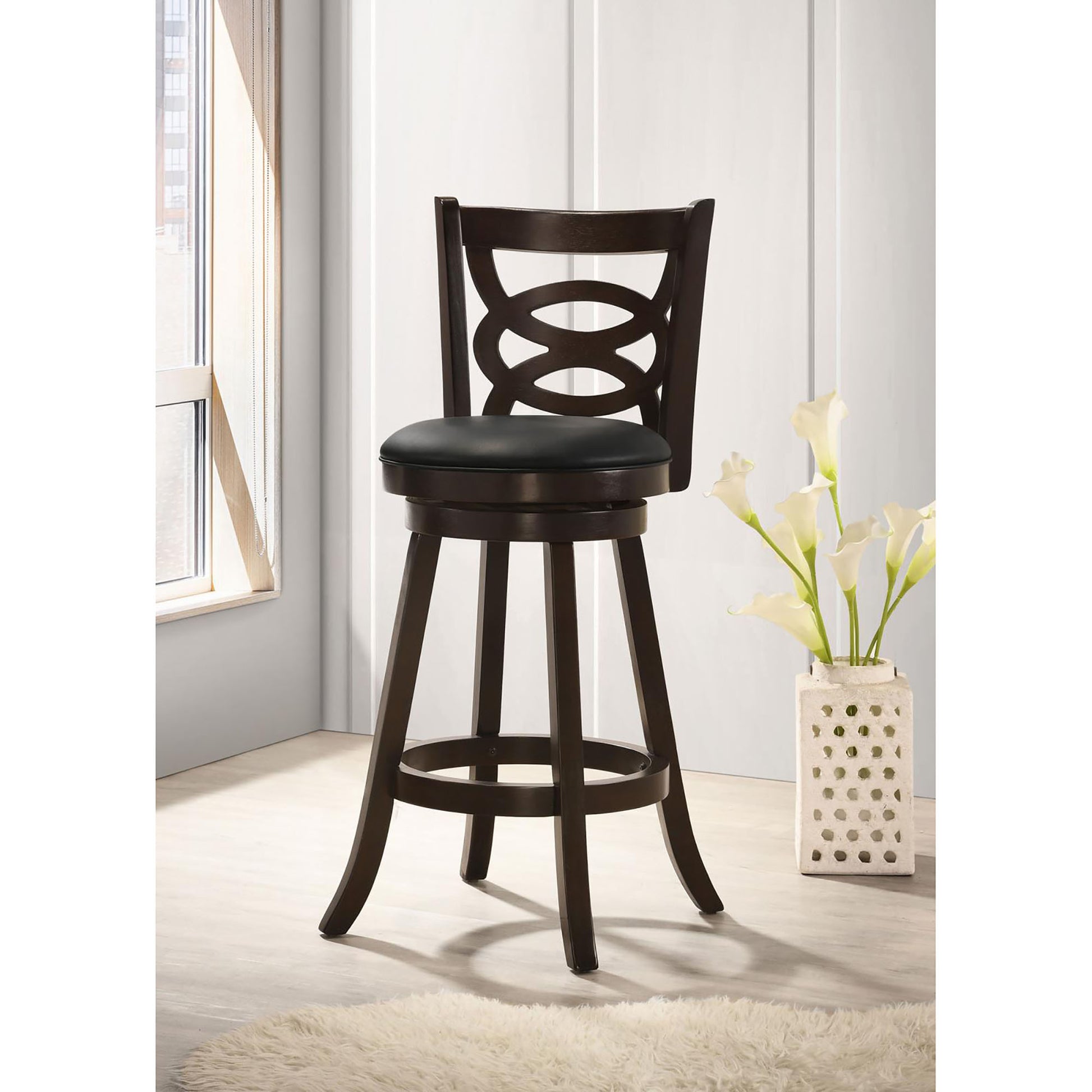 Dark brown wooden swivel bar stool with black upholstered seat and decorative backrest
