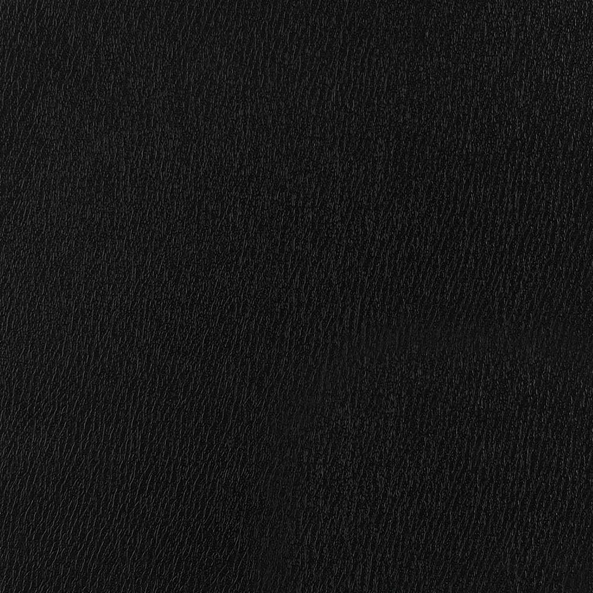 Closeup of a black faux leather texture ideal for upholstery and accessories