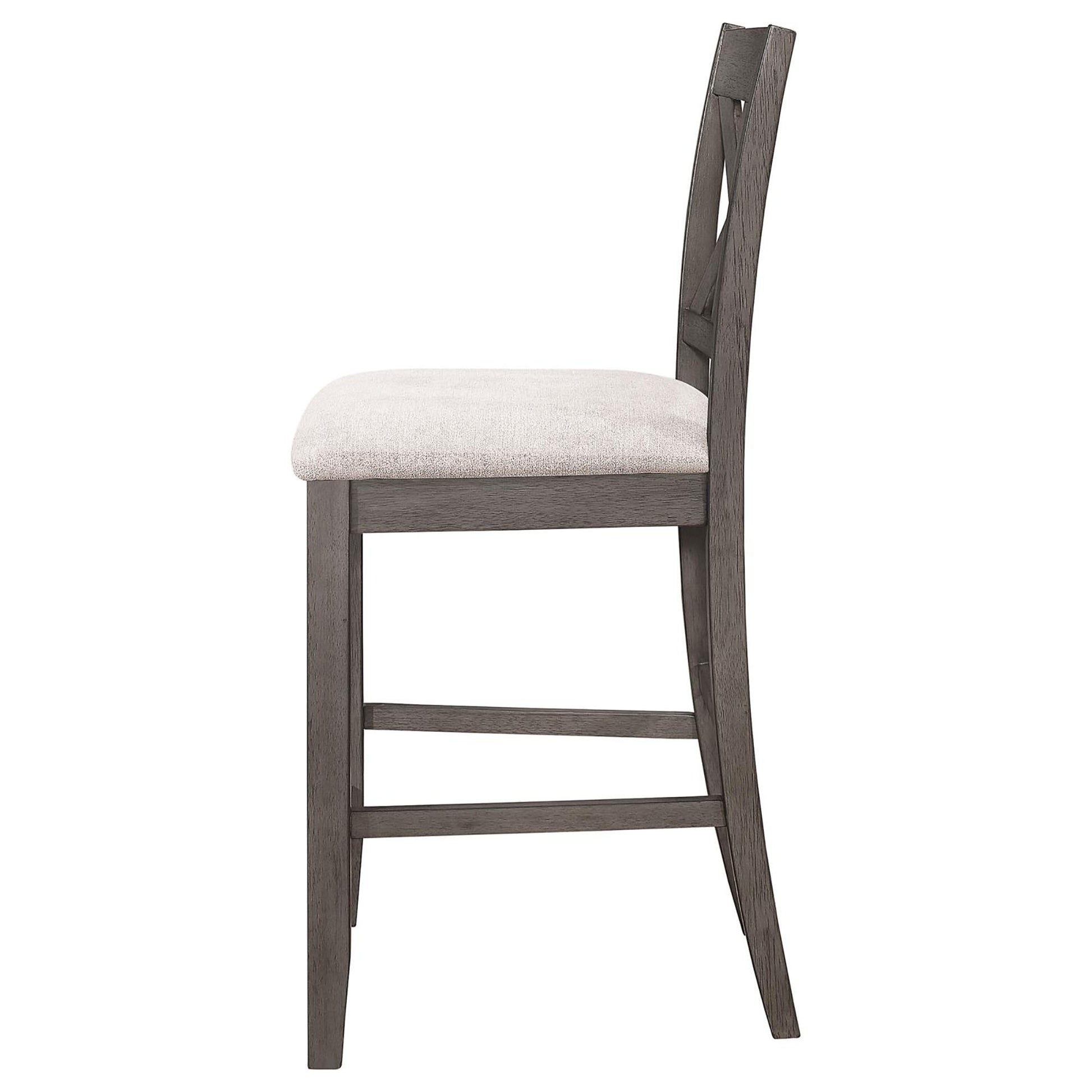 Side view of a grey wooden bar stool with a textured white seat and crisscross back