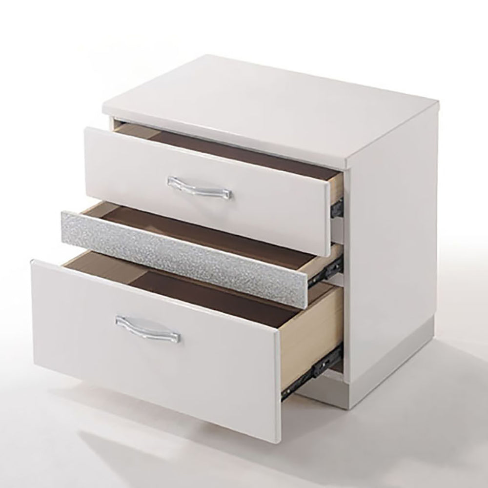 White threedrawer nightstand with crystal handles and a textured middle drawer front