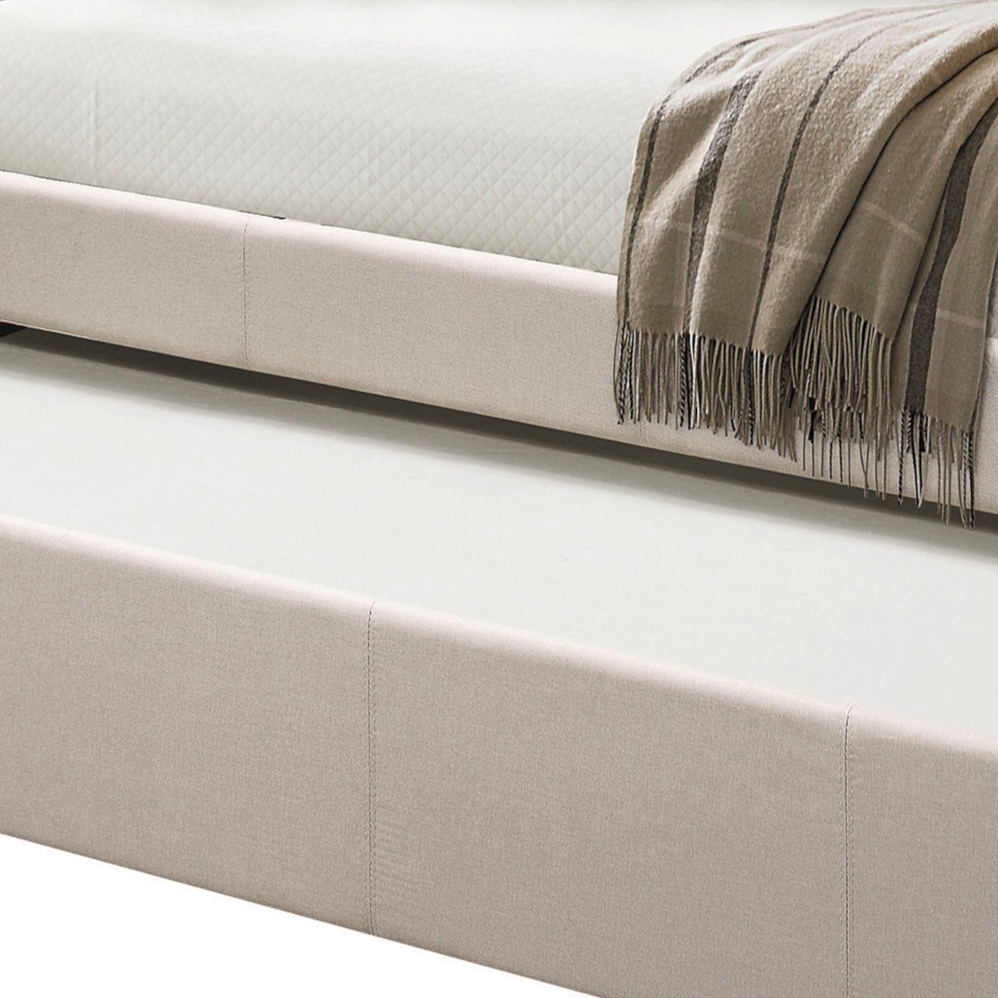 Light beige upholstered bed frame with pullout trundle perfect for guest rooms