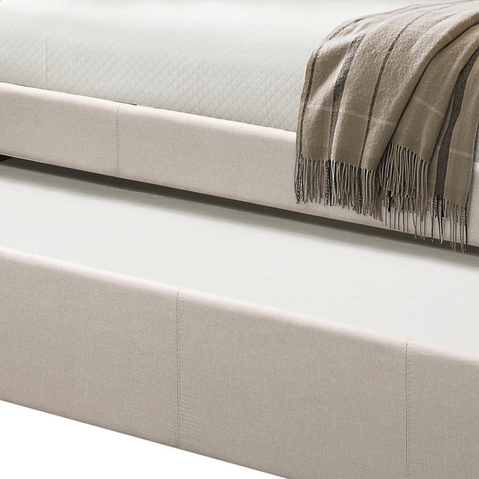 Light beige upholstered bed frame with pullout trundle perfect for guest rooms