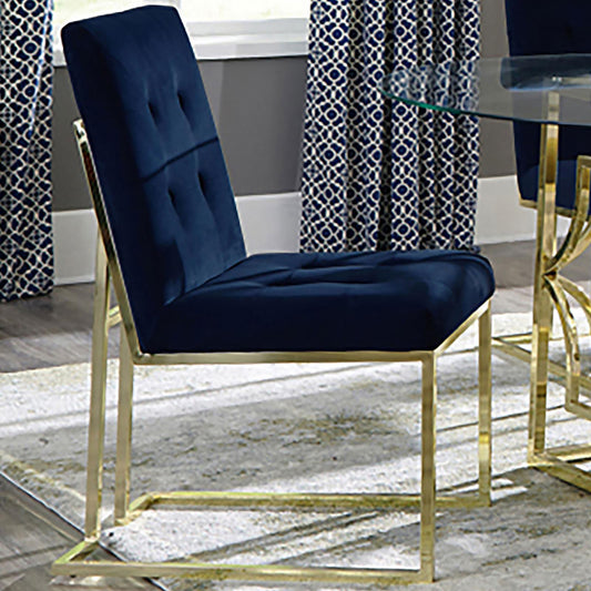 Navy blue velvet dining chair with gold metal legs and diamond tufting