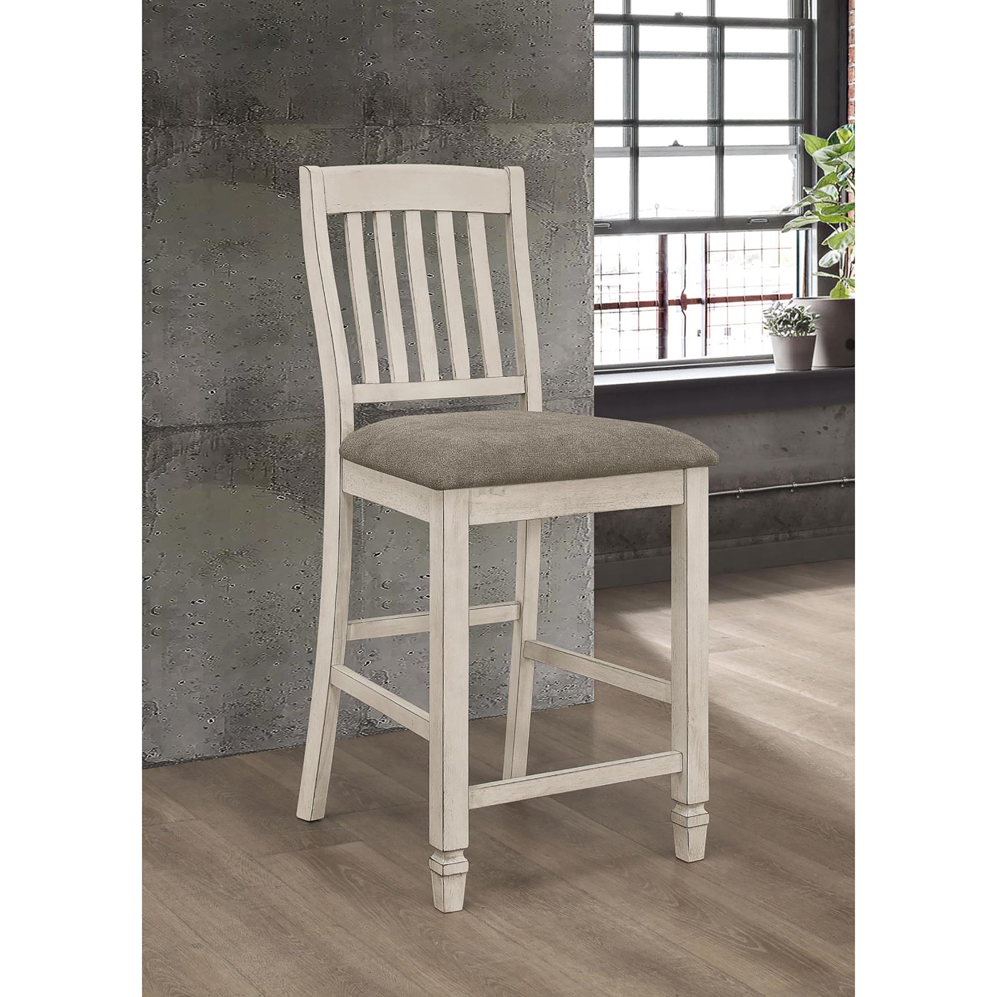 Distressed white wood bar stool with a gray upholstered seat and slatted back