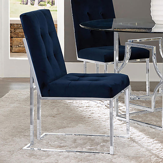 Navy velvet dining chair with tufted back and polished chrome frame