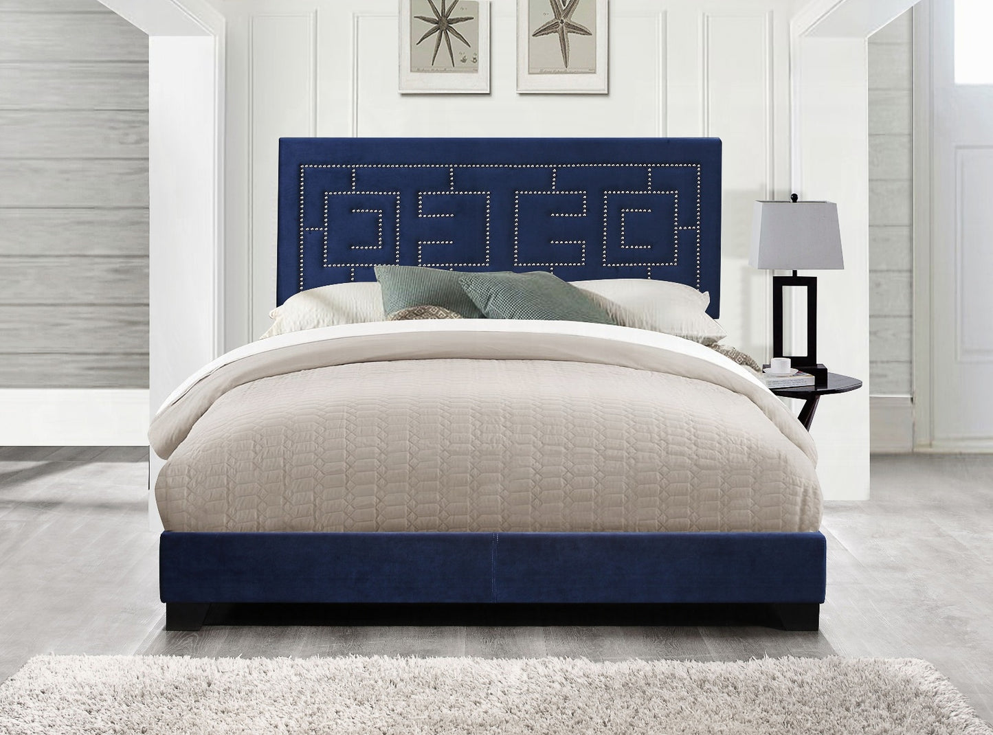 Navy blue velvet bed frame with upholstered geometric headboard and silver nailhead trim