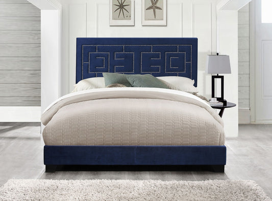 Navy blue velvet bed frame with upholstered geometric headboard and silver nailhead trim