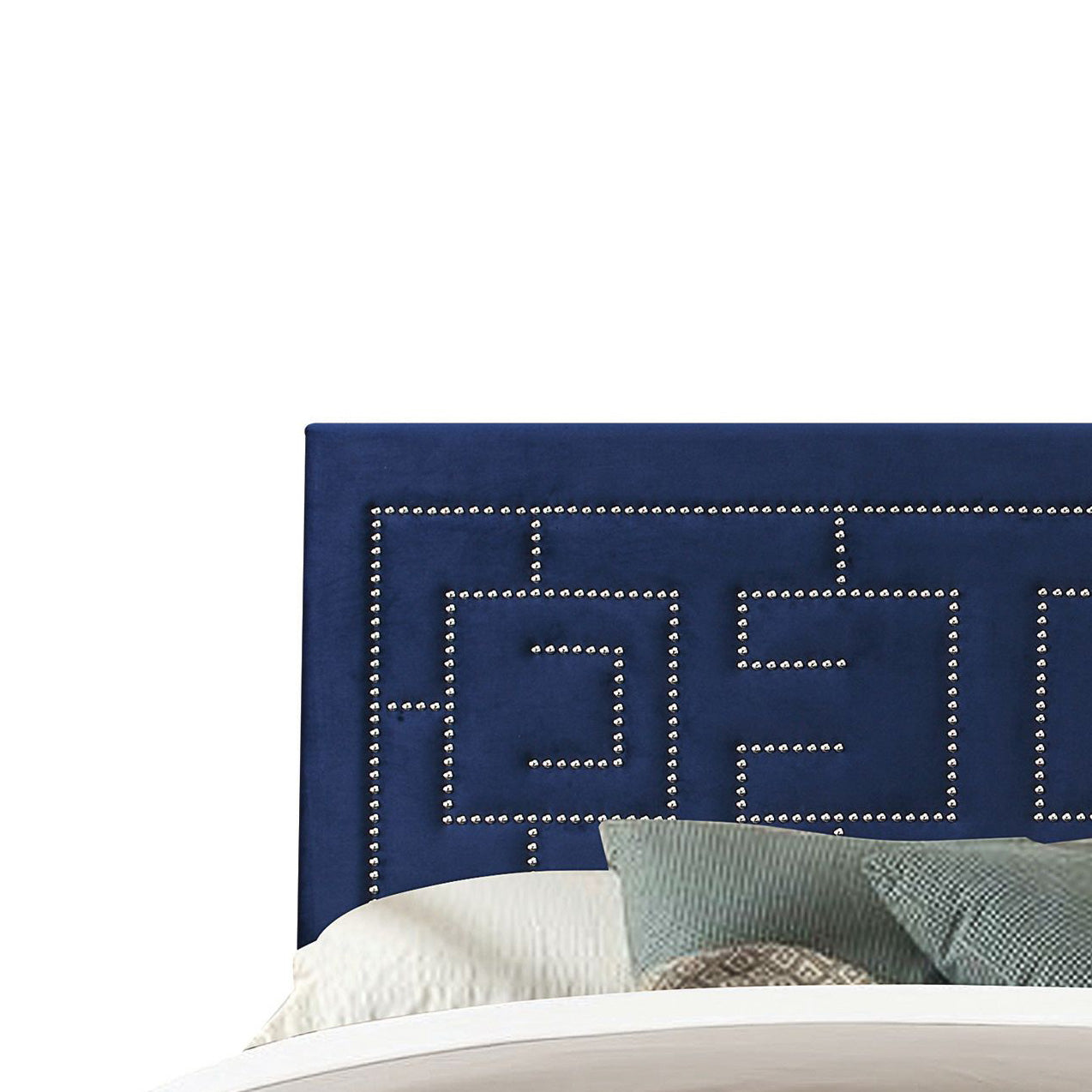 Navy velvet headboard with geometric nailhead trim detail