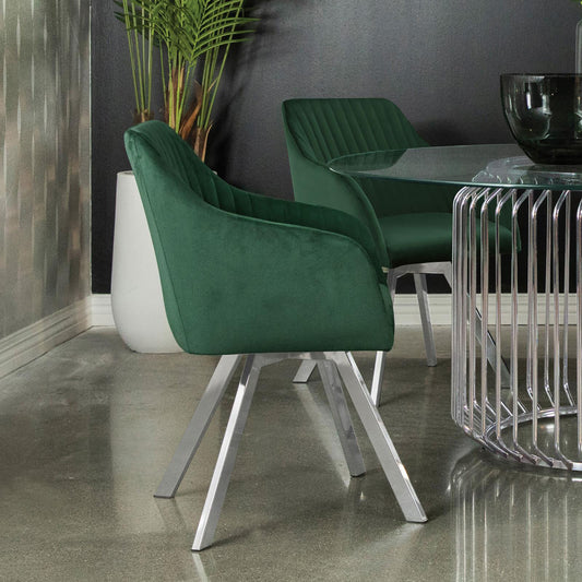 Emerald green velvet dining chair with diamond tufting and chrome legs