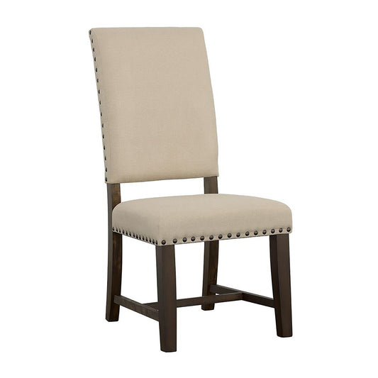 Upholstered beige dining chair with dark wood legs and brass nailhead trim